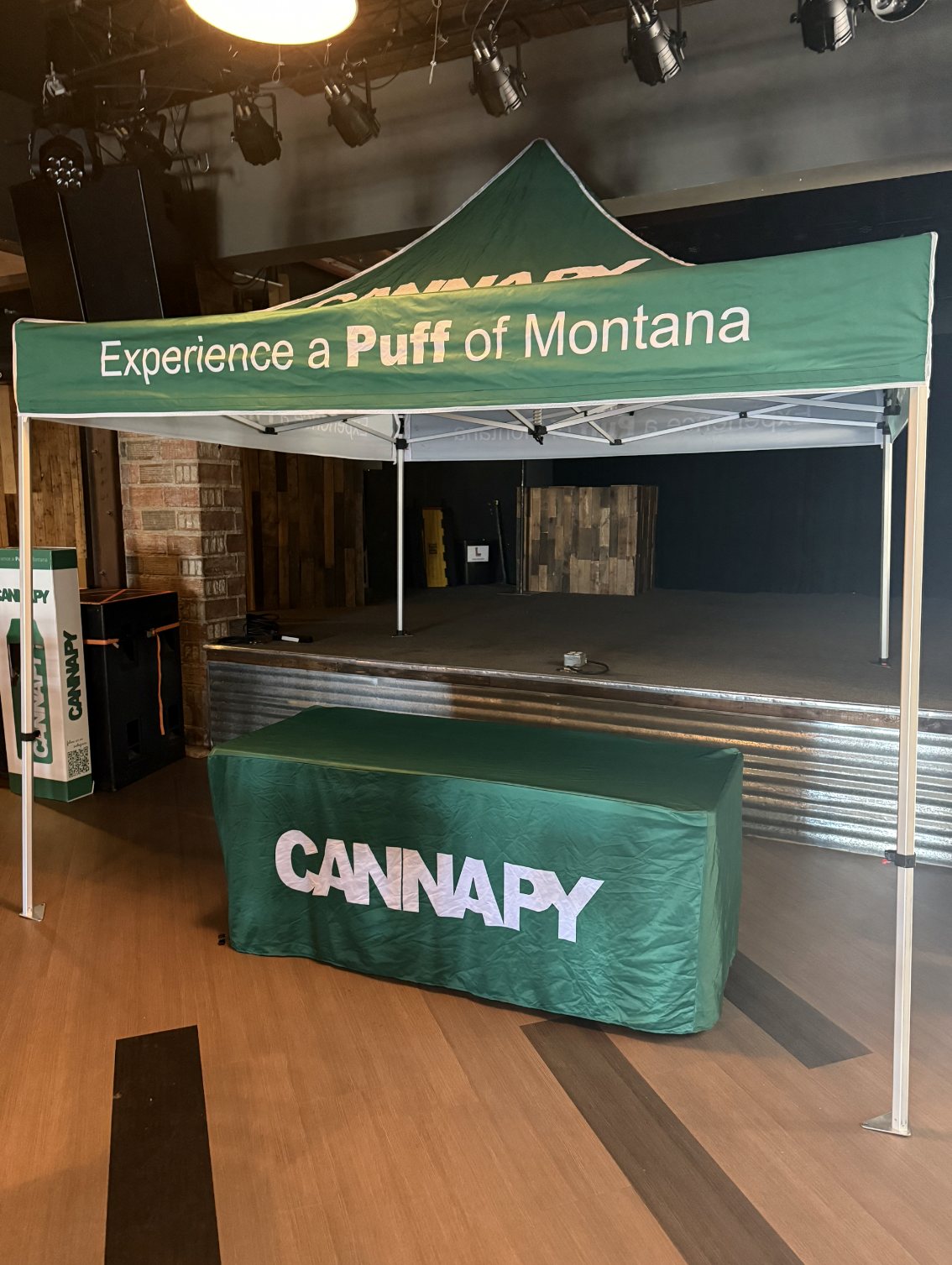 Cannapy tent and table set up at a Montana music venue